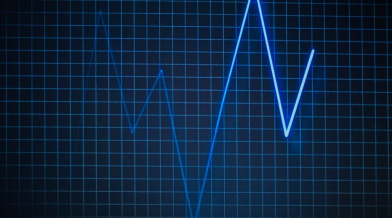 A blue line graph on a dark background showing fluctuations over a grid.