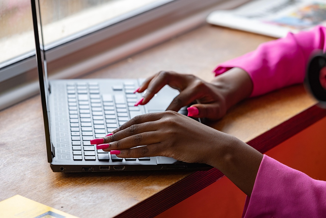 Laptop, typing, working — Showcase Your Commitment to Privacy with HIPAA Certified Status
